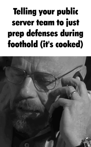 A Man With Glasses Is Talking On A Phone And The Caption Says Telling Your Public Server Team To Just Prep Defenses Duri GIF