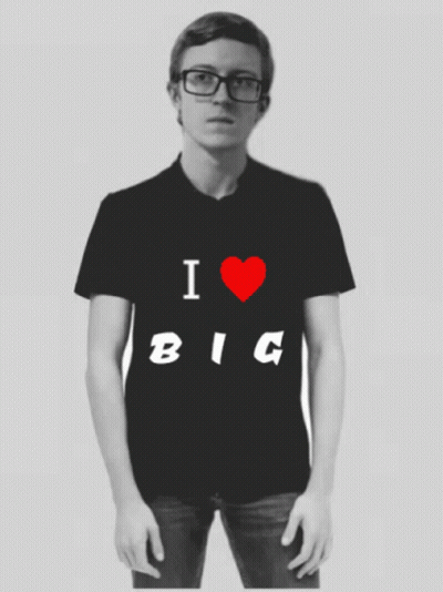 A Man With Glasses Is Wearing A Black Shirt That Says I Love Big GIF