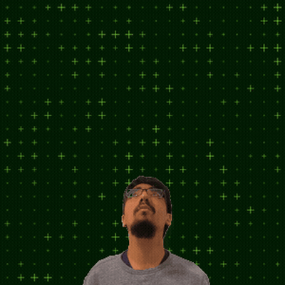 A Man With Glasses Looks Up At A Glowing Number 15 GIF