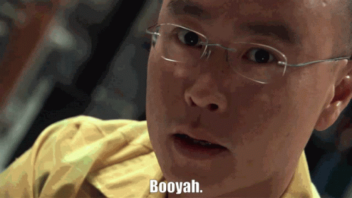 A Man With Glasses Says Booyah In A Close Up GIF