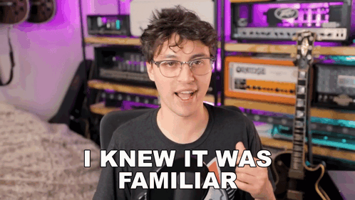 A Man With Glasses Says " I Knew It Was Familiar " In Front Of A Guitar GIF