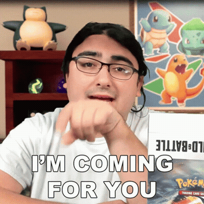 A Man With Glasses Says " I 'M Coming For You " In Front Of A Box Of Pokemon Cards GIF