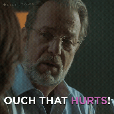 A Man With Glasses Says Ouch That Hurts In Pink Letters GIF