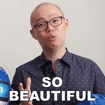 A Man With Glasses Says So Beautiful In Front Of A Blue Balloon GIF