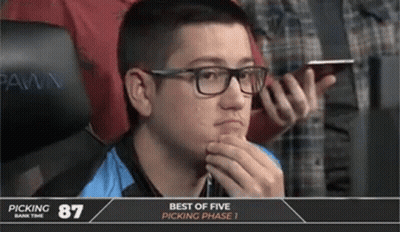 A Man With Glasses Sits In Front Of A Screen That Says Picking 87 GIF
