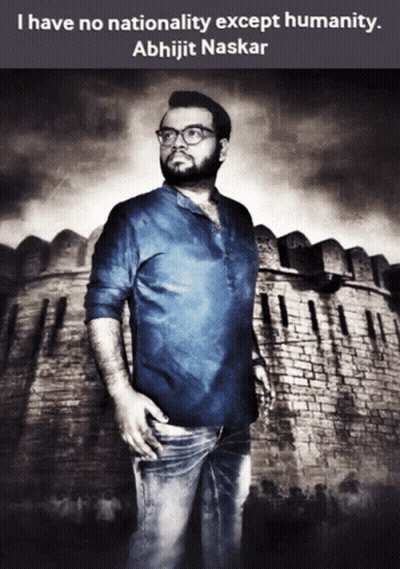 A Man With Glasses Stands In Front Of A Brick Wall With A Quote By Abhijit Naskar GIF