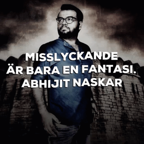 A Man With Glasses Stands In Front Of A Brick Wall With The Words Misslyckande Ar Bara En Fantasi Abhijit Naskar GIF