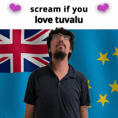 A Man With Glasses Stands In Front Of A British Flag And Says Scream If You Love Tuvalu GIF