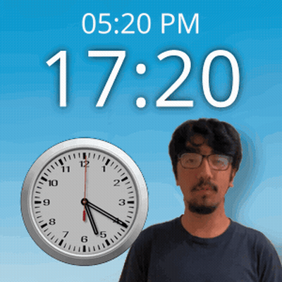 A Man With Glasses Stands In Front Of A Clock That Says 17:20 Pm GIF