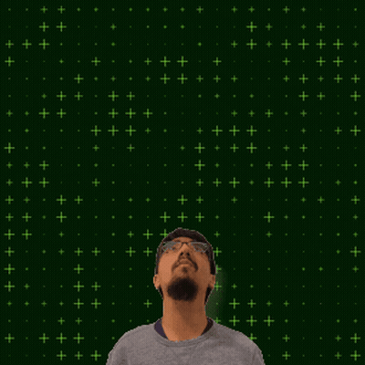 A Man With Glasses Stands In Front Of A Green Background That Says 8 15 GIF