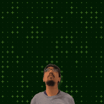 A Man With Glasses Stands In Front Of A Green Background With The Number 15 And 2 GIF