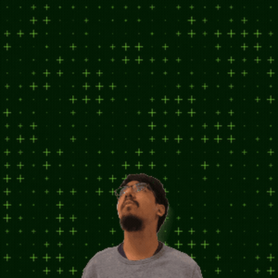 A Man With Glasses Stands In Front Of A Green Background With The Number 4 And 9 On It GIF