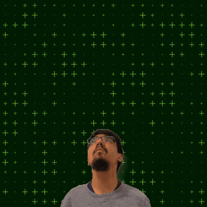 A Man With Glasses Stands In Front Of A Green Background With The Number 6 + 7 On It GIF
