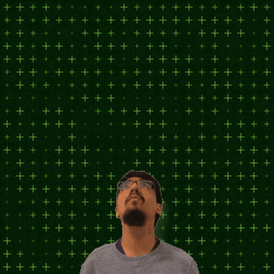 A Man With Glasses Stands In Front Of A Green Background With The Number 9 And 15 On It GIF