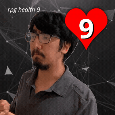A Man With Glasses Stands In Front Of A Red Heart With The Number 9 On It GIF