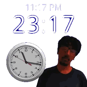 A Man With Glasses Stands Next To A Clock That Says 11:17 Pm Sticker
