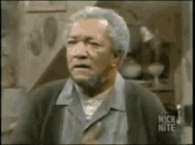 A Man With Gray Hair And A Beard Is Making A Funny Face In A Nick Nite Video . GIF
