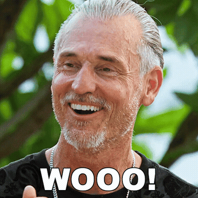 A Man With Gray Hair And A Beard Is Smiling With The Word Wooo Written Below Him GIF
