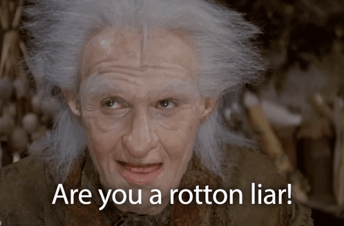 A Man With Gray Hair And The Words " Are You A Rotton Liar " On The Bottom GIF