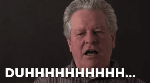 A Man With Gray Hair Is Making A Funny Face With His Eyes Closed And The Words Duhhhh . GIF
