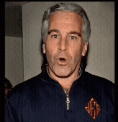 A Man With Gray Hair Is Wearing A Blue Jacket And Making A Surprised Face . GIF