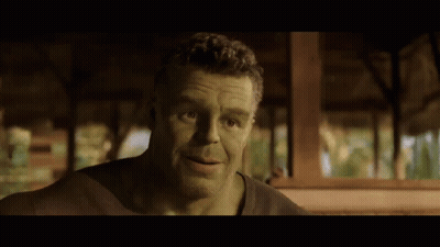 A Man With Green Hair And A Beard Is Looking At The Camera GIF