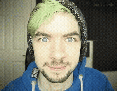 A Man With Green Hair And A Beard Wears A Blue Hoodie GIF