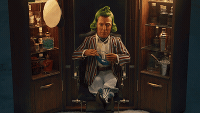 A Man With Green Hair Is Sitting In A Chair With The Words " Goodnight Sir " Below Him GIF