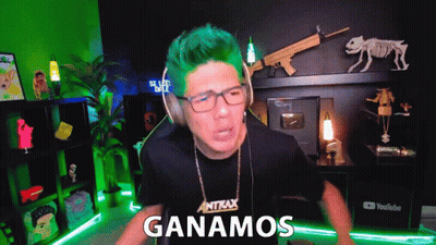 A Man With Green Hair Is Wearing Headphones And A Shirt That Says Antax On It GIF