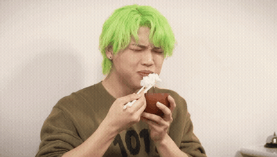 A Man With Green Hair Wearing A Shirt With The Number 101 On It GIF