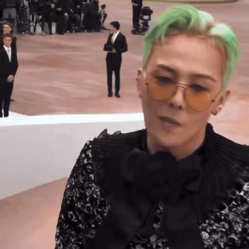 A Man With Green Hair Wearing Sunglasses And A Black Shirt GIF