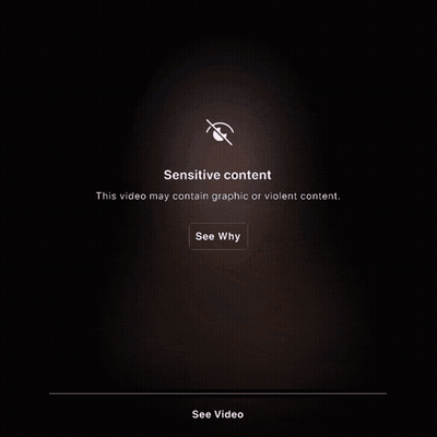 A Man With Headphones And A Cane Standing Next To A Barrel That Says Sensitive Content On It GIF