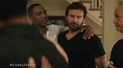 A Man With His Arm Around Another Man With The Council Of Dads Written On The Bottom Of The Screen GIF