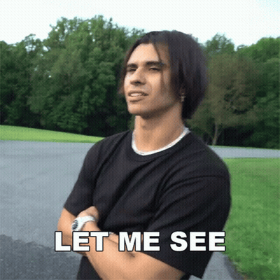 A Man With His Arms Crossed And The Words Let Me See Above Him GIF