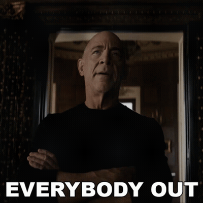 A Man With His Arms Crossed Stands In Front Of A Mirror With The Words " Everybody Out " Below Him GIF