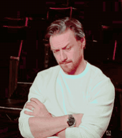 A Man With His Arms Crossed Wearing A Watch And A White Shirt GIF