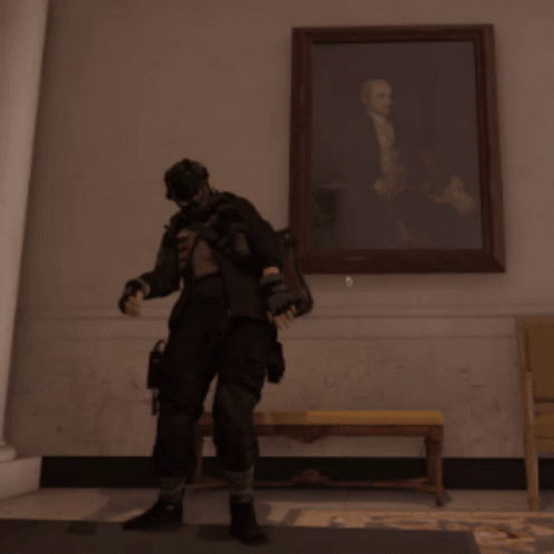 A Man With His Arms In The Air In Front Of A Picture GIF