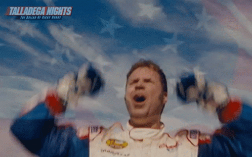 A Man With His Arms In The Air With The Words Talladega Nights On The Bottom Right GIF