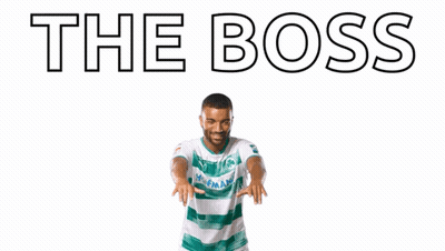 A Man With His Arms In The Air With The Words " The Boss " Written Above Him GIF