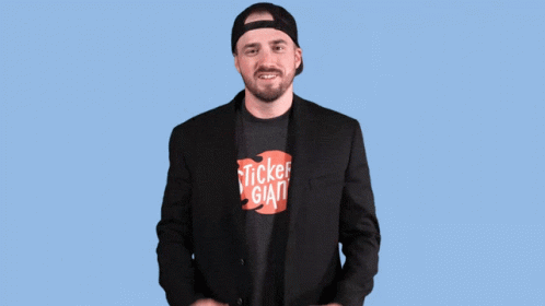 A Man With His Arms Outstretched In Front Of A Happy Anniversary Sign GIF