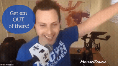 A Man With His Arms Outstretched Is Wearing A Blue Shirt That Says Brett Meiselas GIF