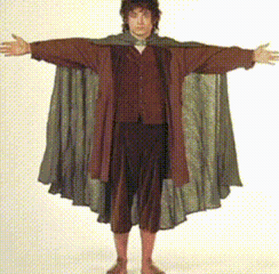 A Man With His Arms Outstretched Is Wearing A Cloak GIF