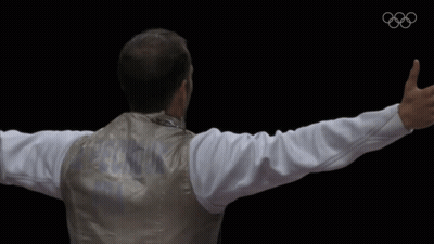 A Man With His Arms Outstretched Is Wearing A Jacket With The Word Argentina On It GIF