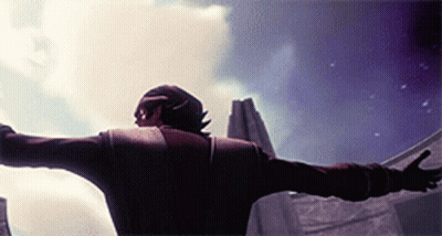A Man With His Arms Outstretched Standing In Front Of A Building GIF