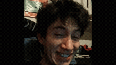 A Man With His Eyes Closed And His Mouth Open GIF