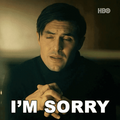 A Man With His Eyes Closed And The Words I 'M Sorry Below Him GIF