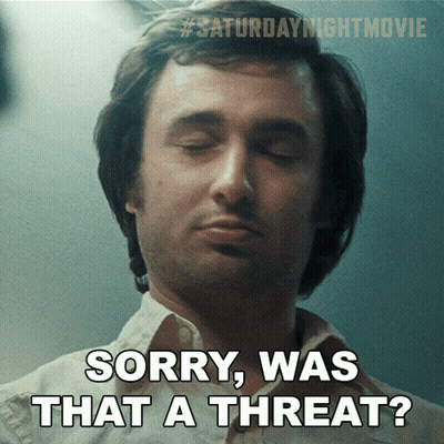 A Man With His Eyes Closed And The Words Sorry Was That A Threat Below Him GIF