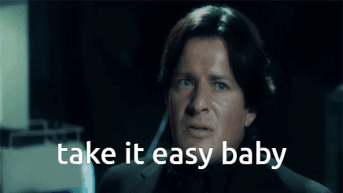 A Man With His Eyes Closed And The Words Take It Easy Baby Above Him GIF
