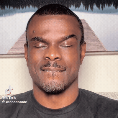 a man with his eyes closed has a tiktok watermark on his face