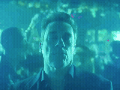 A Man With His Eyes Closed In A Blue Room GIF